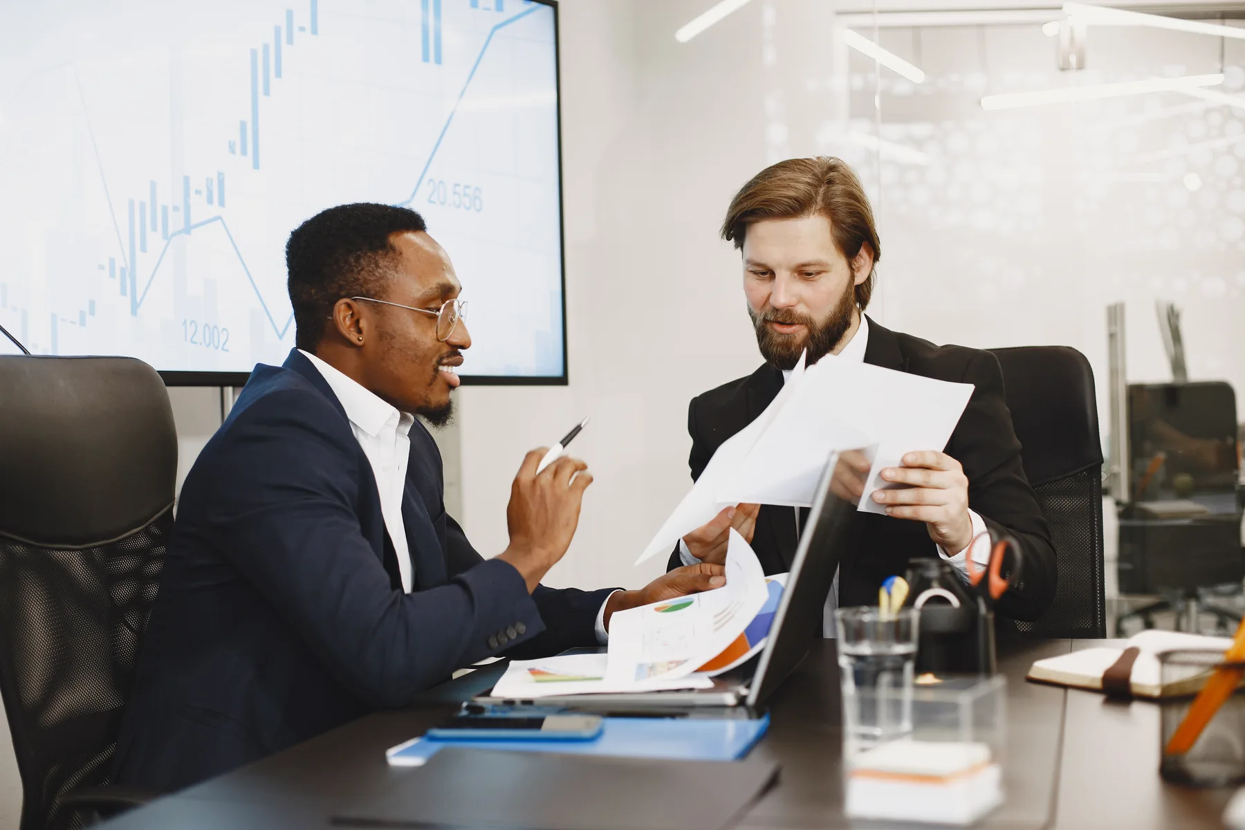 Business partners reviewing an FBR-accepted invoice together